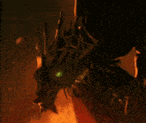 a dragon with a green eye is surrounded by flames