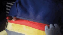 a blue item with a red stripe on it