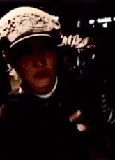 a person wearing a mask with taesatelite written on the bottom