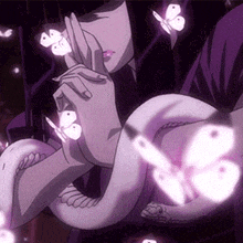 a woman is holding a snake with butterflies coming out of it .