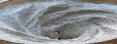 a man in a suit is standing in the middle of a swirl of water