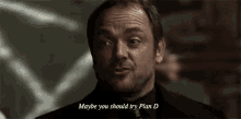a man with a beard is talking to someone and says maybe you should try plan d .