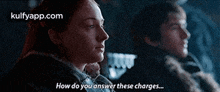 a man and a woman are sitting next to each other and the woman is saying `` how do you answer these charges '' .