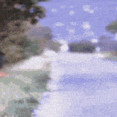 a blurred picture of a river with trees in the background