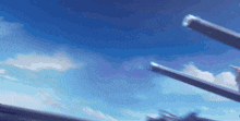 a blue sky with a few clouds and a few guns in the foreground