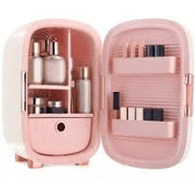 a pink mini refrigerator filled with cosmetics and bottles of perfume .