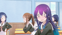 a girl with purple hair is sitting in a classroom
