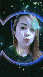 a woman 's face is displayed in a circle with the words capcut below her