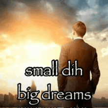 a man in a suit is standing in front of a sunset with the words `` small dih big dreams '' above him .