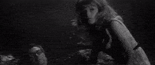a black and white photo of a person 's head with a burst of light coming out of it .
