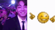 a man in a suit and tie is smiling next to a pixelated smiley face