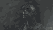 a close up of a man 's face with a hbo logo in the corner