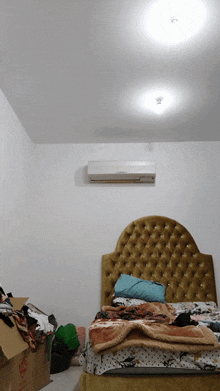 a bedroom with a bed and a box that says ' sdn ' on it