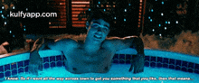 a picture of a man in a hot tub with the website kulfyapp.com written on the bottom