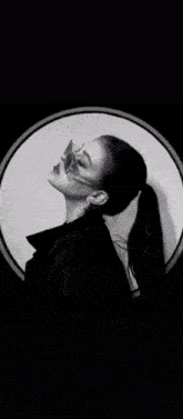 a black and white photo of a clock with a circle in the middle of it .