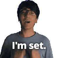 a man with glasses and a grey shirt says i 'm set