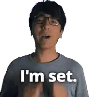 a man with glasses and a grey shirt says i 'm set