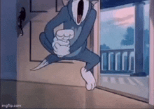 tom and jerry are jumping in the air in a cartoon .