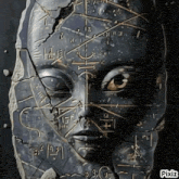 a statue of a face has arabic writing on it and pixiz written on the bottom