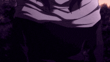 a close up of a person 's hand with a purple scarf around their neck