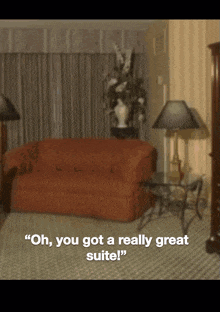 a blurred image of a living room with the words " oh you got a really great suite " at the bottom
