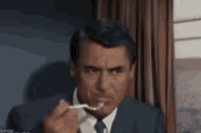 Hungry Cary Grant Northwest Hitchcock Train Thornhill Roger Eating GIF - Hungry Cary Grant Northwest Hitchcock Train Thornhill Roger Eating GIFs