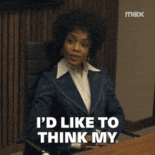 a woman in a suit sits at a table with the words " resume speaks for itself " below her