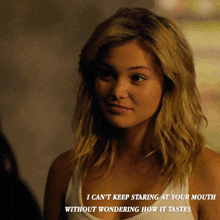 a woman in a white tank top with a caption that says i can 't keep staring at your mouth