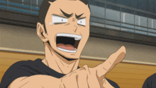 a man in a black shirt making a funny face with his mouth open