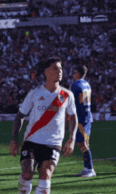 a soccer player wearing a white jersey that says codere