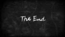 the end is written on a blackboard with drawings