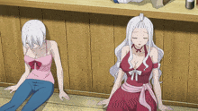 a couple of anime girls sitting on the floor
