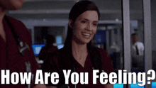 a woman is smiling while talking to a man and says how are you feeling