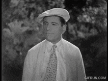 a black and white photo of a man with a gifrun.com watermark on the bottom