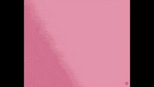 a close up of a girl 's face with pink hair and a red ribbon around her neck .