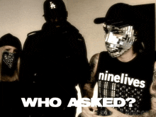 a man wearing a shirt that says ninelives is standing next to two other people