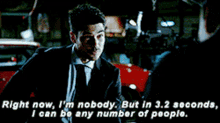 a man in a suit and tie is saying right now i 'm nobody