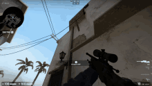 a person holding a sniper rifle in front of a building that says stopped amp on it