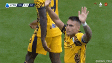 a soccer player celebrates a goal during a match