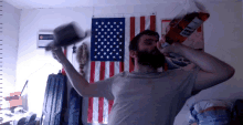 a man with a beard is holding a large bag of doritos