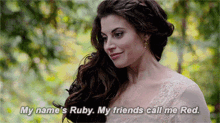 a woman in a white dress is talking about her name ruby