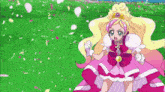 a girl in a pink dress is standing in a field
