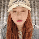 a woman wearing a hat that says " vietnam " on it