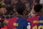 a group of soccer players including one wearing a shirt that says sufiti