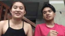 a man and a woman are posing for a picture together