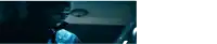 a man is talking on a cell phone in the dark