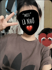 a girl wearing a mask that says " miss " on it
