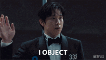a man in a tuxedo says i object in front of a sign that says netflix