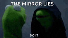 kermit the frog is standing next to a muppet wearing a hood and says `` the mirror lies do it '' .
