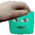 a person is holding a wallet with a cartoon face on it .